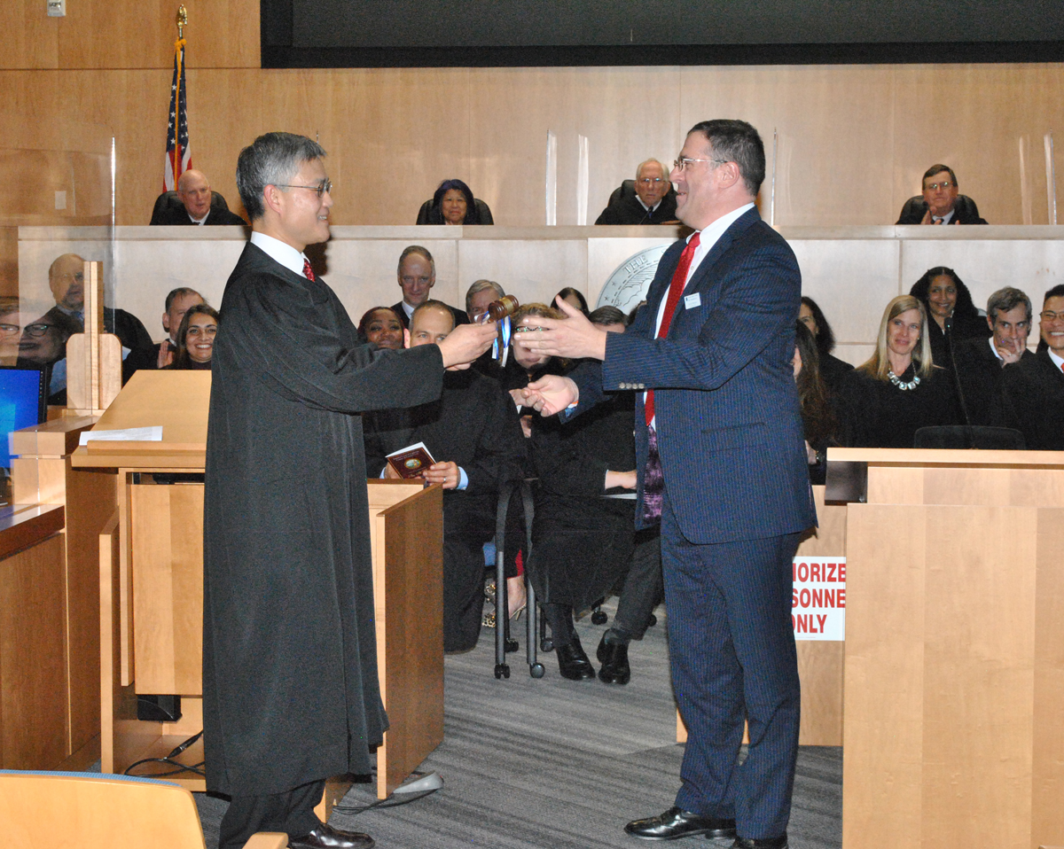 Judge Peter Chang accepts the gavel from David Pearson, President of the CCCBA.