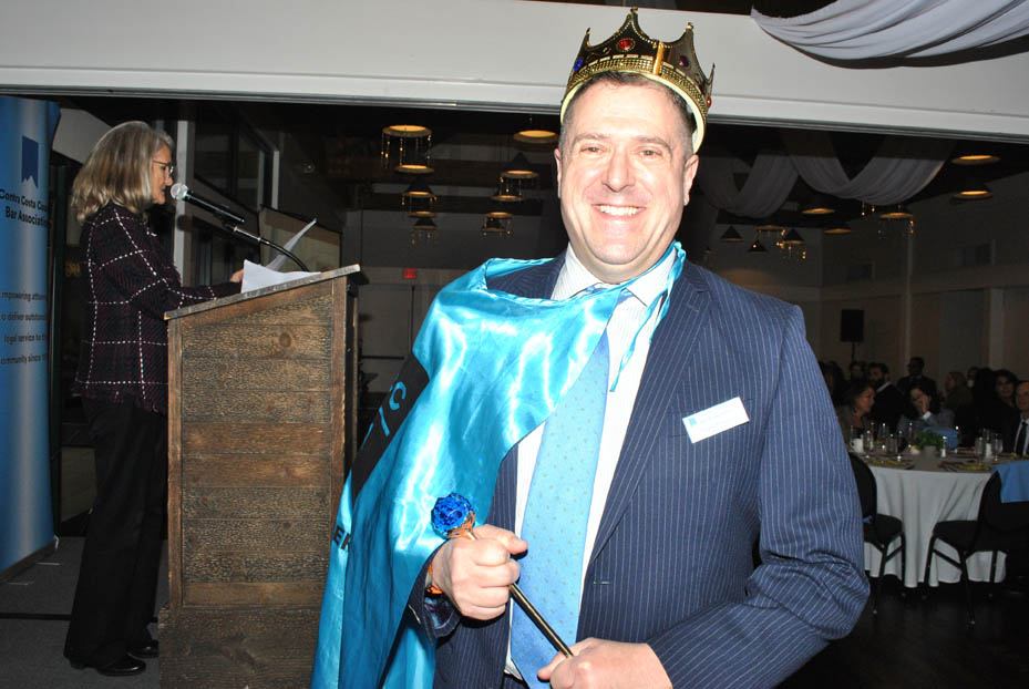 CCCBA Board President 2024, David Pearson smiling and wearing crown and holding scepter