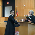 Judge Glenn Kim takes the Oath of Office from Judge Mary Ann O'Malley