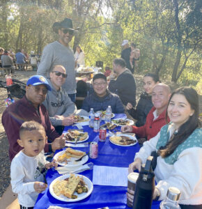 A group eating at a picnic table